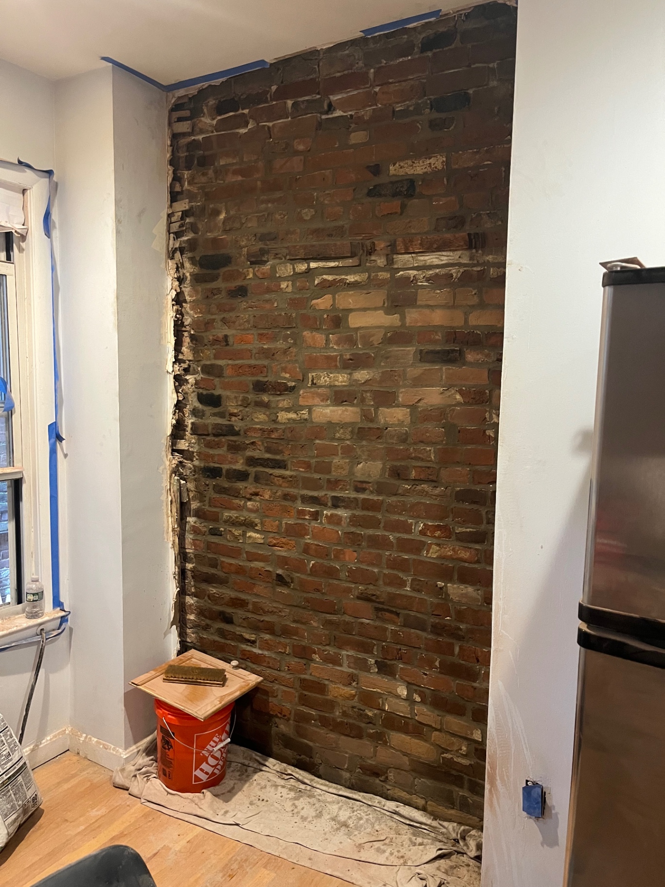 Interior brick wall exposed during a masonry restoration