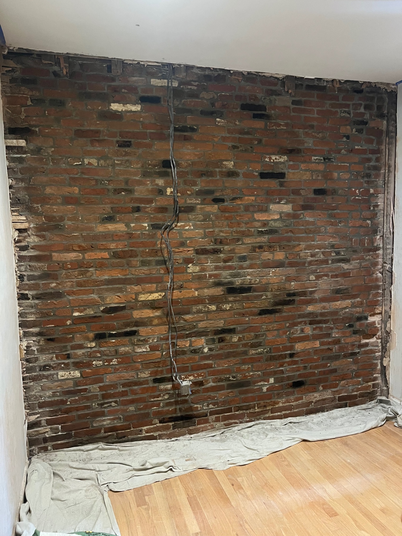 Restored and repointed interior exposed brick accent wall