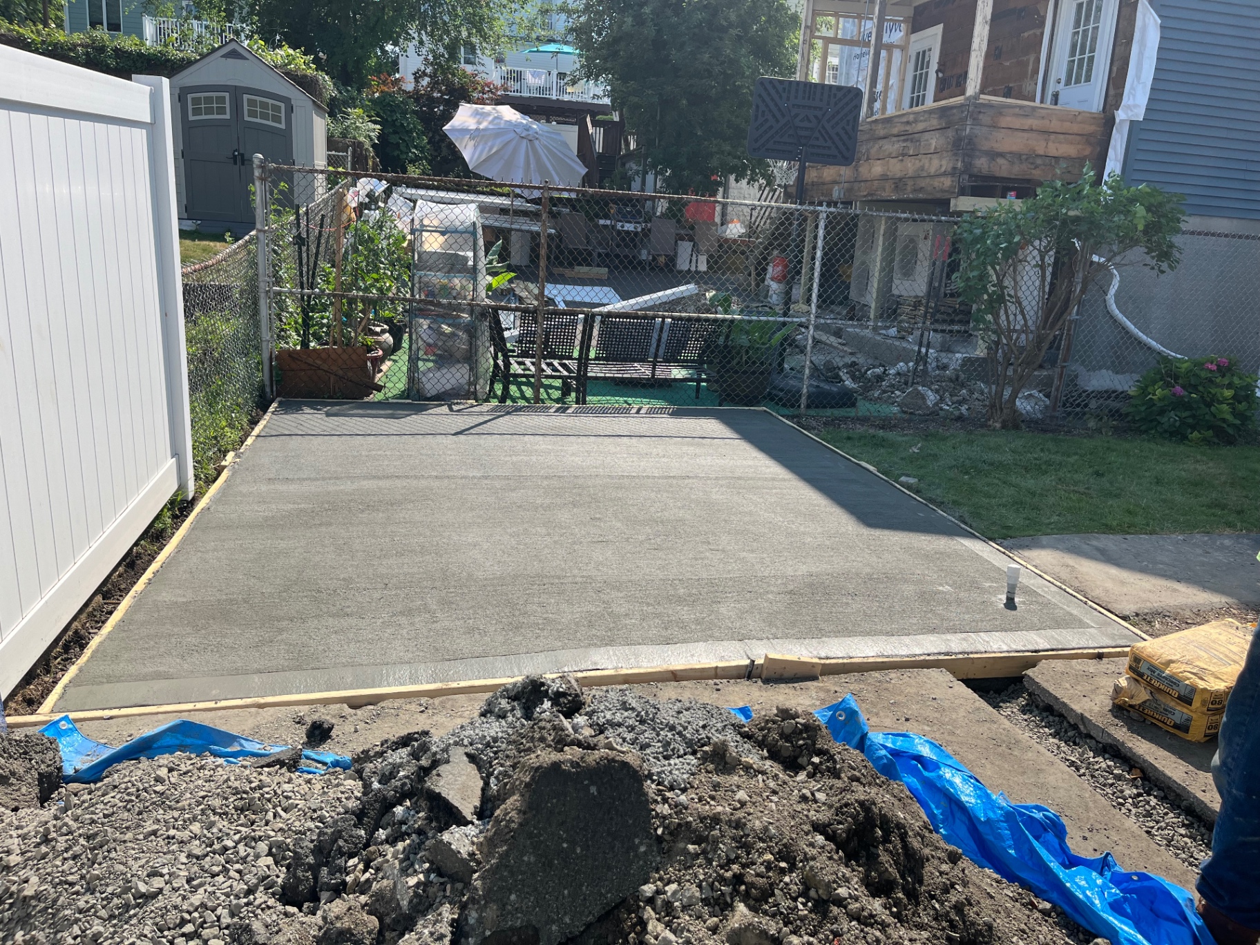 Freshly finished concrete backyard slab